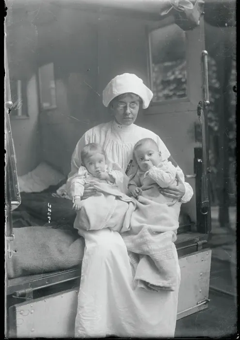 Framed Print : Board of Health Nurse Holding Babies Framed Print : Board of Health Nurse Holding Babies
