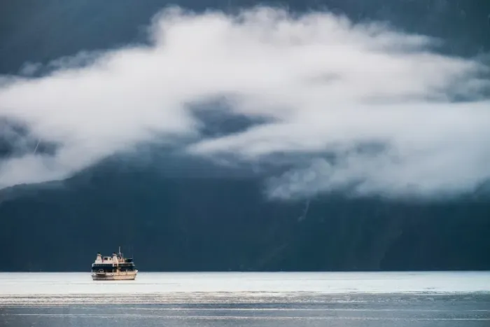 Framed Print : A boat explores Milford Sound Framed Print : A boat explores Milford Sound