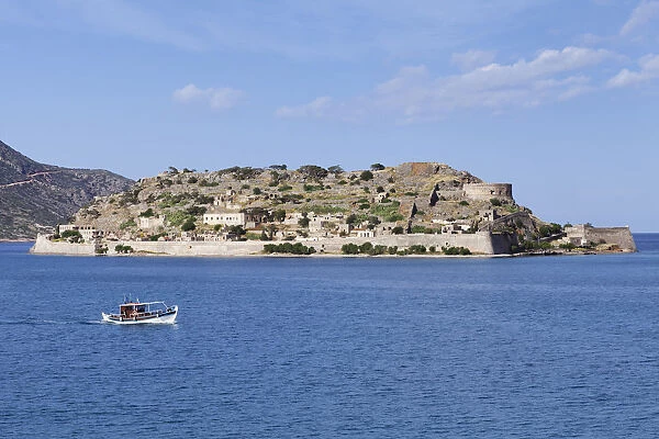 Boat off the Spinalonga peninsula, Kalidon, Elounda Gulf, Crete, Greece