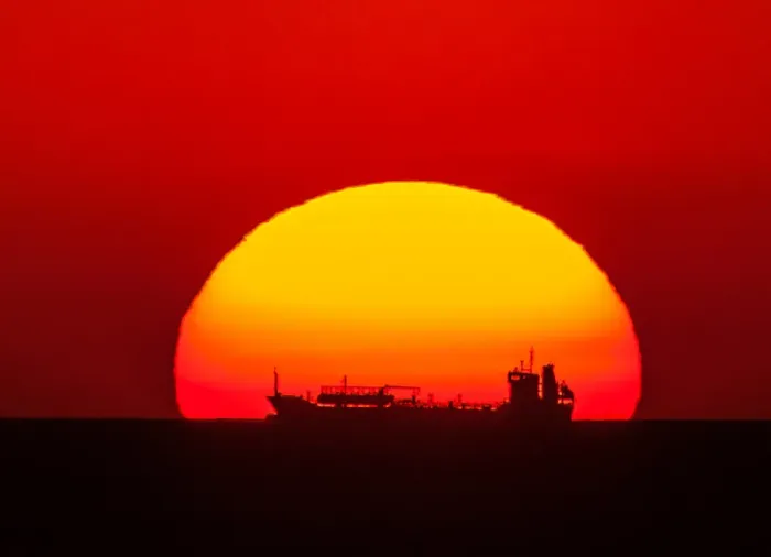 Framed Print : Boat in the setting sun