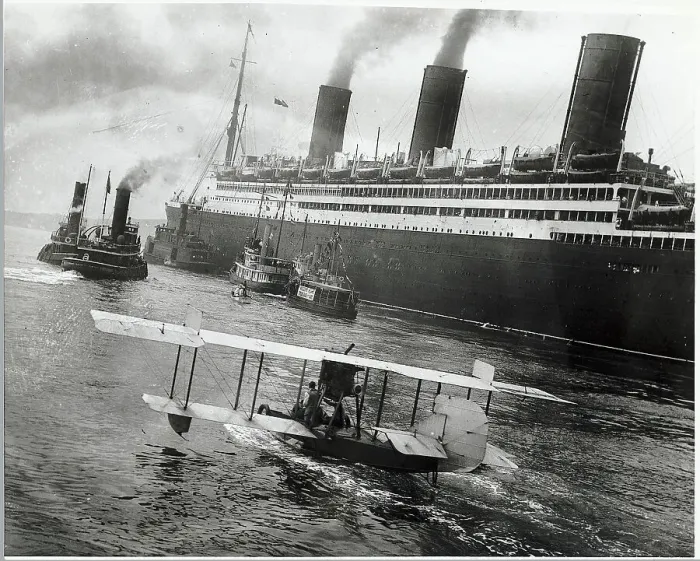 Framed Print : Boats & Airplane Greet Ocean Liner Framed Print : Boats & Airplane Greet Ocean Liner