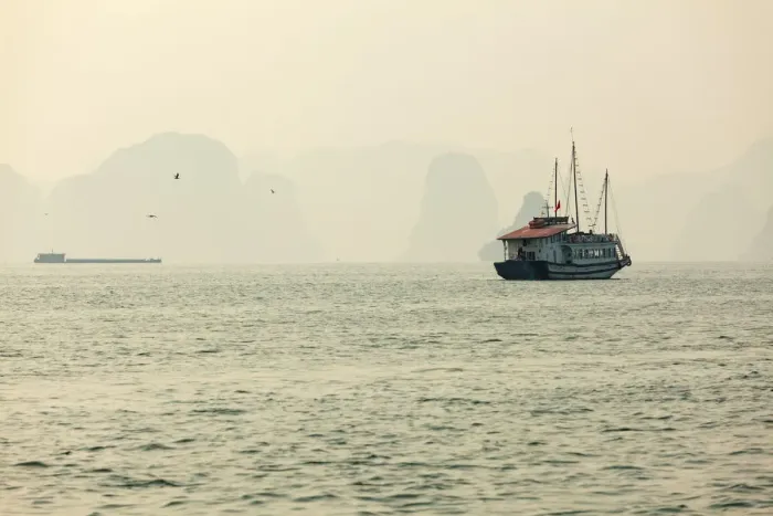 Framed Print : boats cruising around karst in the world famous place halong bay in north Vietnam Framed Print : boats cruising around karst in the world famous place halong bay in north Vietnam