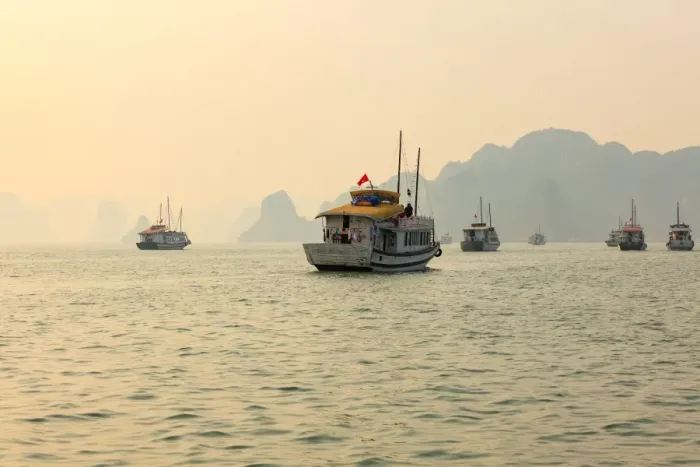 Framed Print : boats cruising around karst in the world famous place halong bay in north Vietnam Framed Print : boats cruising around karst in the world famous place halong bay in north Vietnam