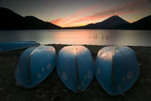 Boats on shore of Lake Motosu with Mount Fuji in background, Fuji-Hakone-Izu National Park, Honshu, Japan