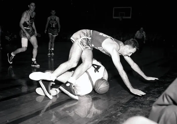 Framed Print : Bob Cousy Tripping Over Player Framed Print : Bob Cousy Tripping Over Player