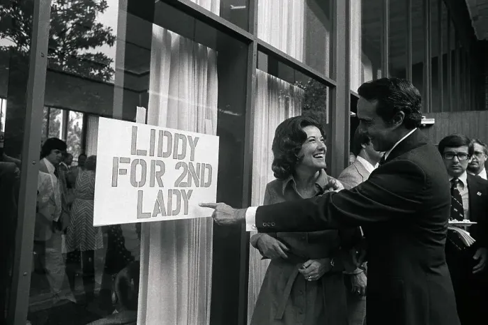 Framed Print : Bob and Elizabeth Dole Looking at Sign