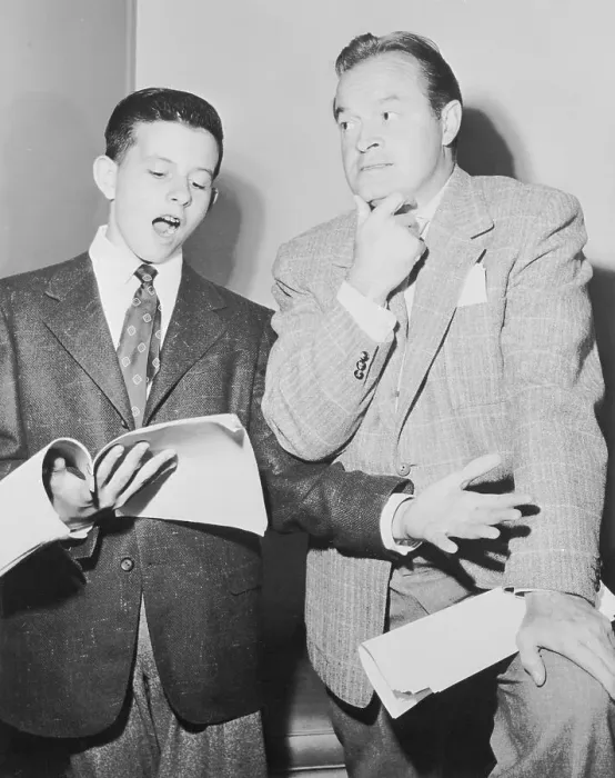 Framed Print : Bob Hope Listening to His Son