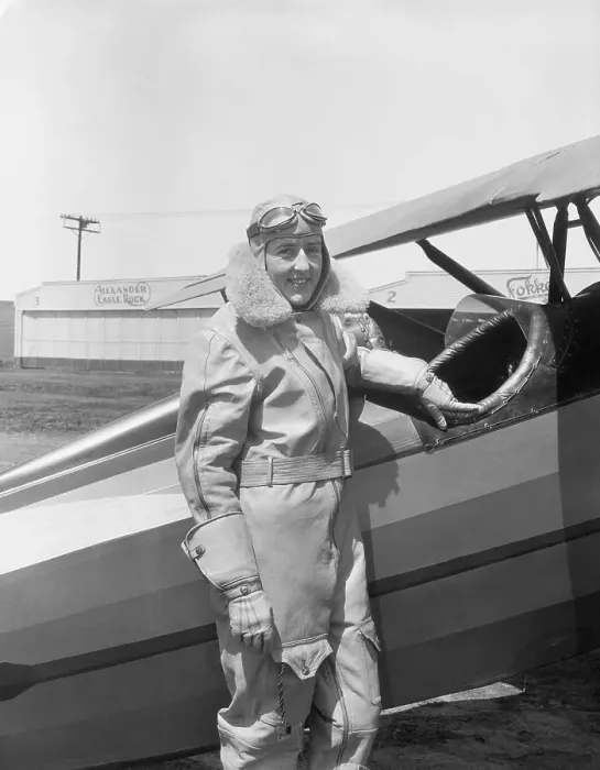 Framed Print : Bobbie Trout Posing Next to an Airplane Framed Print : Bobbie Trout Posing Next to an Airplane