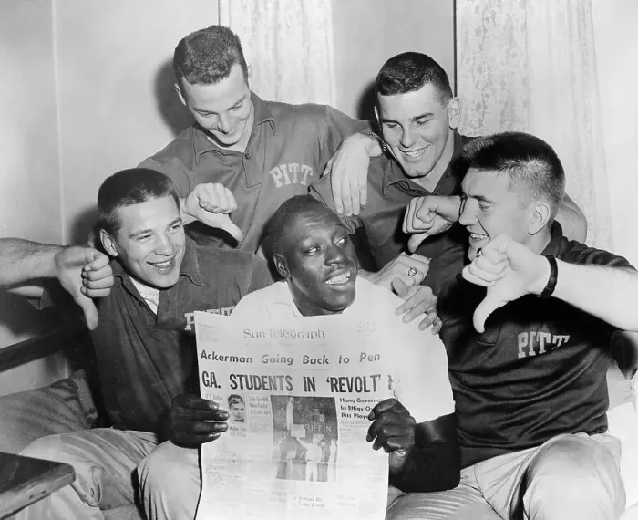 Framed Print : Bobby Grier Holding Newspaper on His Team's Protests