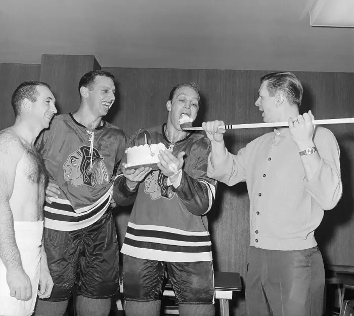 Framed Print : Bobby Hull Eating Cake from Hockey Stick Framed Print : Bobby Hull Eating Cake from Hockey Stick