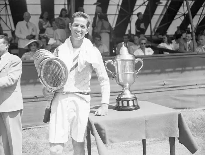Framed Print : Bobby Riggs with Stack of Racquets Framed Print : Bobby Riggs with Stack of Racquets