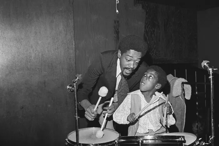 Framed Print : Bobby Seale Playing Drums with Son