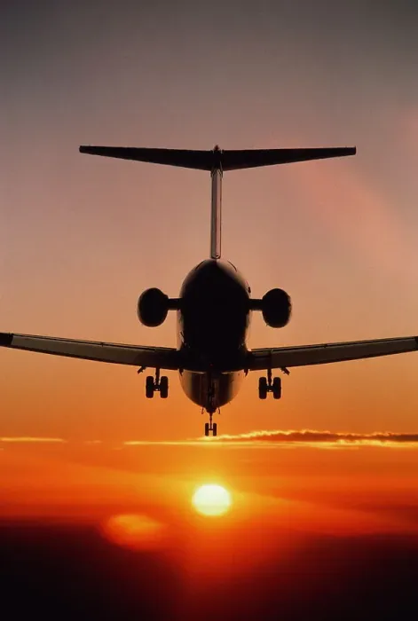 Framed Print : Boeing MD-80 airliner landing at sunset Framed Print : Boeing MD-80 airliner landing at sunset