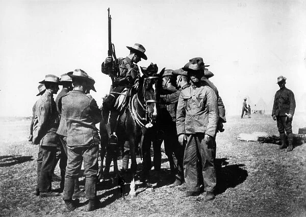 Boer War. circa 1900: G I Vs bringing news to the troops