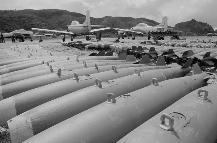 Framed Print : Bombs and Training Airplanes at Military Base in Laos Framed Print : Bombs and Training Airplanes at Military Base in Laos