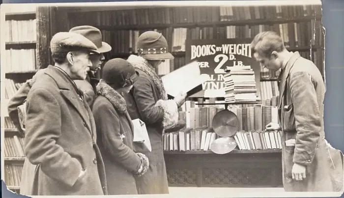 Framed Print : Book Customers Browsing Selection Framed Print : Book Customers Browsing Selection