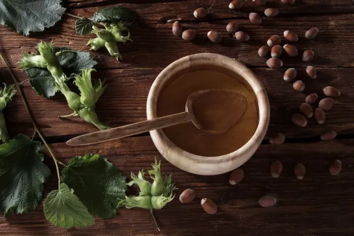 Framed Print : A bowl of hazelnut oil and some ripe and unripe hazelnuts (Corylus avellana) on rustic wooden boards Framed Print : A bowl of hazelnut oil and some ripe and unripe hazelnuts (Corylus avellana) on rustic wooden boards