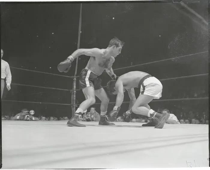 Framed Print : Boxer Chavez Falling from Punch by Paddy De Marco Framed Print : Boxer Chavez Falling from Punch by Paddy De Marco