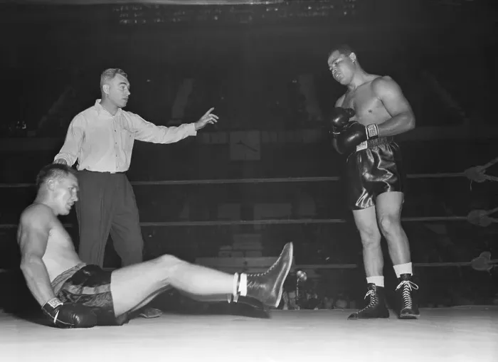Framed Print : Boxer Goes Down in Match with Joe Louis