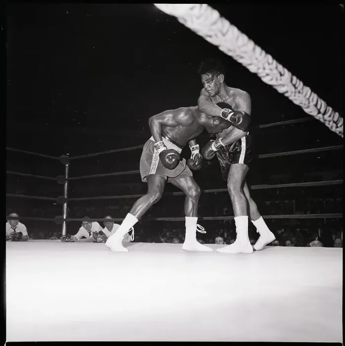 Framed Print : Boxer Held Under Arm Of Bloody Opponent Framed Print : Boxer Held Under Arm Of Bloody Opponent