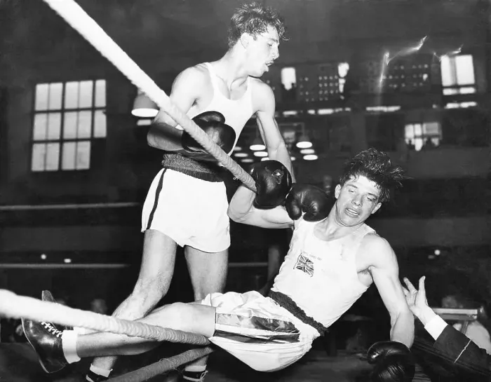 Framed Print : Boxer Knocked Out of Ring at Olympics Framed Print : Boxer Knocked Out of Ring at Olympics