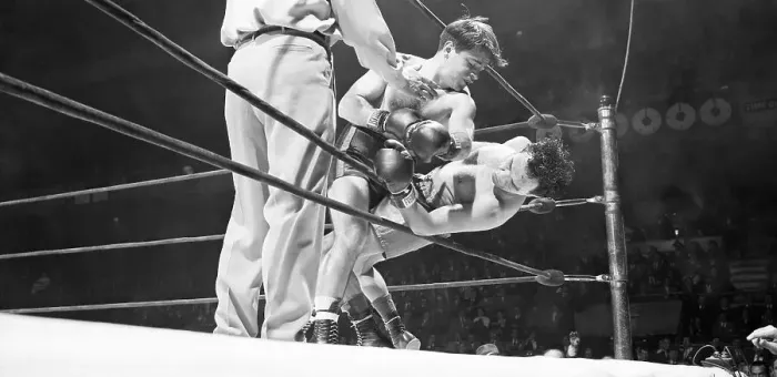 Framed Print : Boxer Against Ropes in Match Framed Print : Boxer Against Ropes in Match