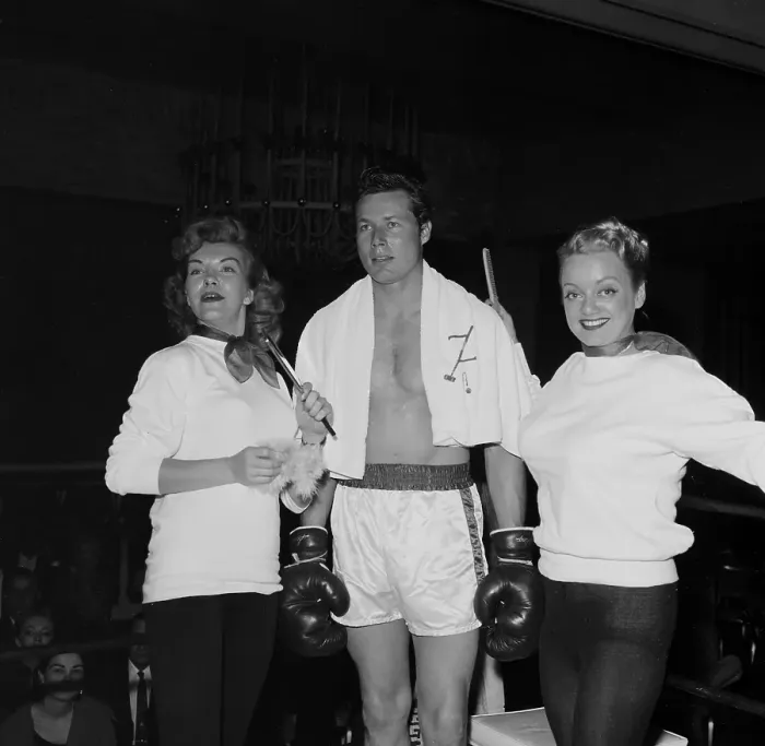 Framed Print : Boxing. LOS ANGELES, CA - CIRCA 1957: A view of two women help support Framed Print : Boxing. LOS ANGELES, CA - CIRCA 1957: A view of two women help support