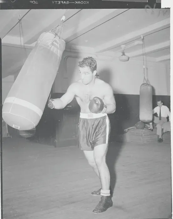 Framed Print : Boxing Champion Rocky Marciano Training with Boxing Bag Framed Print : Boxing Champion Rocky Marciano Training with Boxing Bag