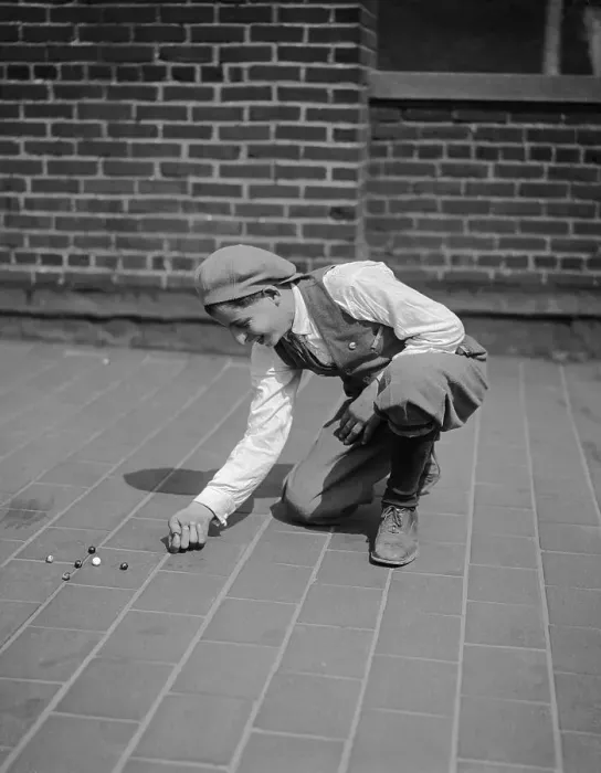 Framed Print : Boy (10-12 years) playing with marbles on pavement. Philadelphia, Pennsylvania, USA. May 06, 1926 Framed Print : Boy (10-12 years) playing with marbles on pavement. Philadelphia, Pennsylvania, USA. May 06, 1926