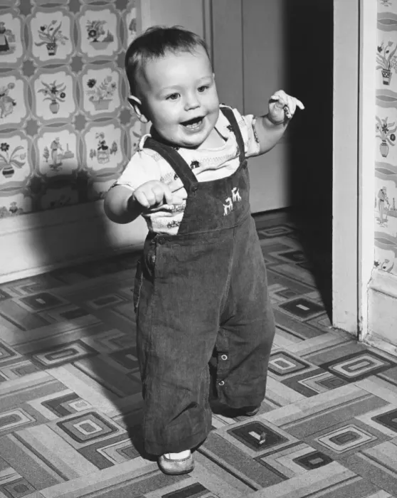 Framed Print : Boy (18-24 months) learning to walk, (B&W)