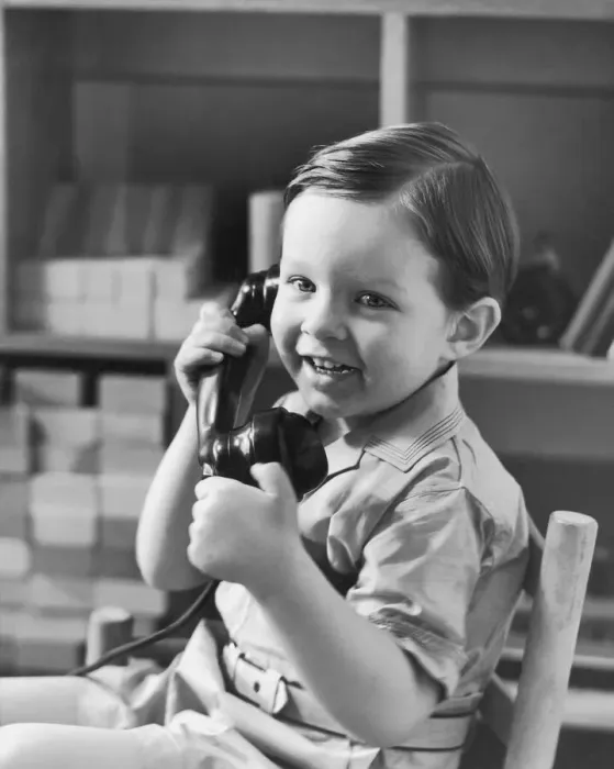 Framed Print : Boy (2-4) holding telephone (B&W) Framed Print : Boy (2-4) holding telephone (B&W)
