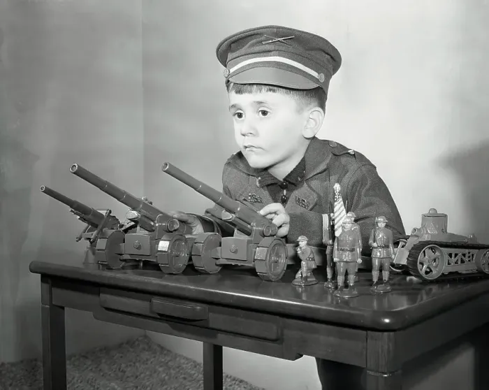 Framed Print : Boy (6-7) with Military Toys