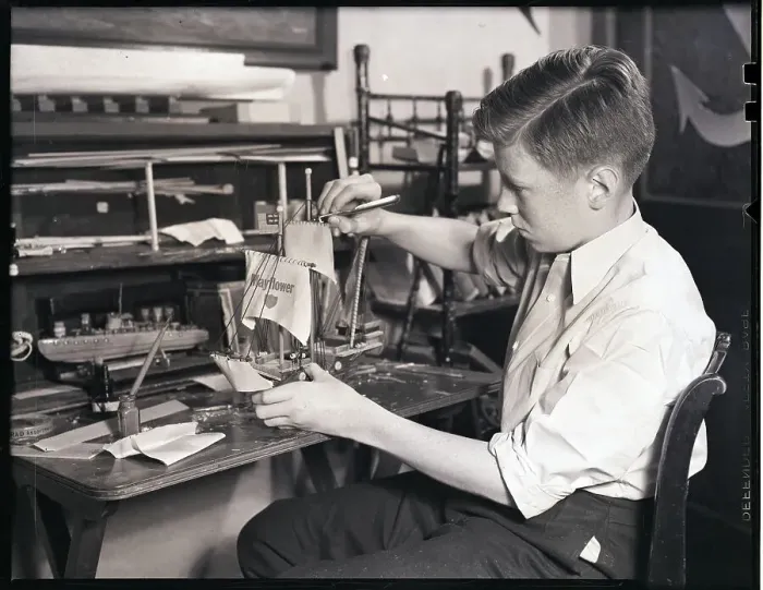 Framed Print : Boy Building a Model Ship Framed Print : Boy Building a Model Ship