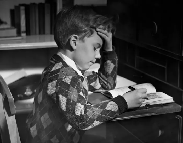 Framed Print : Boy in classroom w / book Framed Print : Boy in classroom w / book