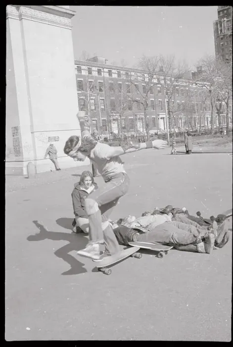 Framed Print : Boy Completing Jump over Bodies onto Skateboard