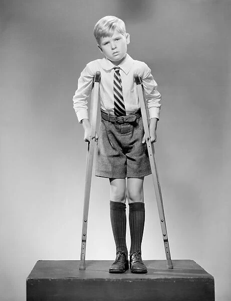 Boy on crutches, portrait