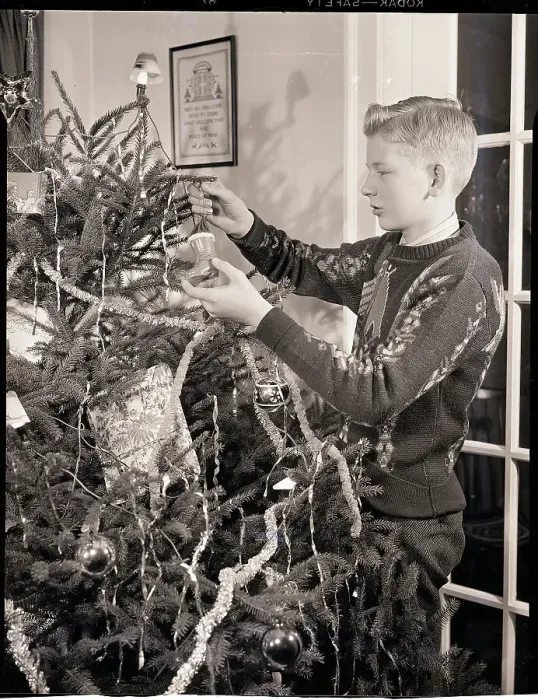 Framed Print : Boy Decorating a Christmas Tree Framed Print : Boy Decorating a Christmas Tree