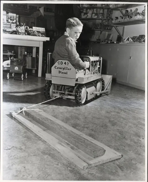 Framed Print : Boy Driving Toy Bulldozer