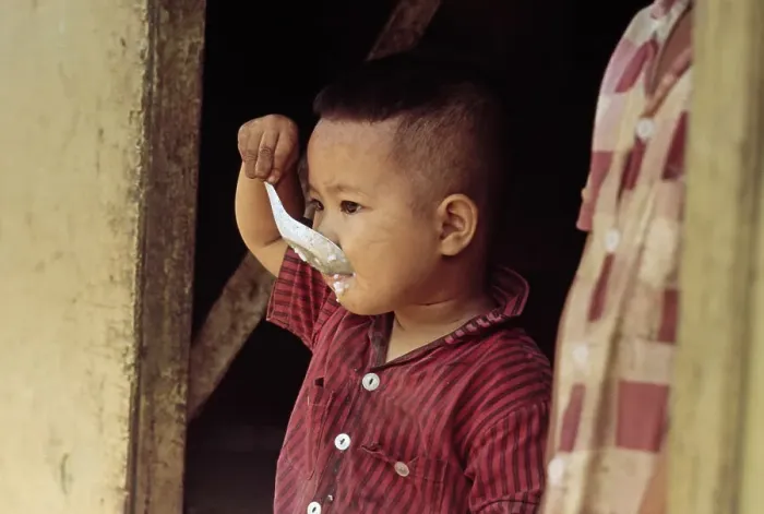 Framed Print : Boy Eating Rice Framed Print : Boy Eating Rice