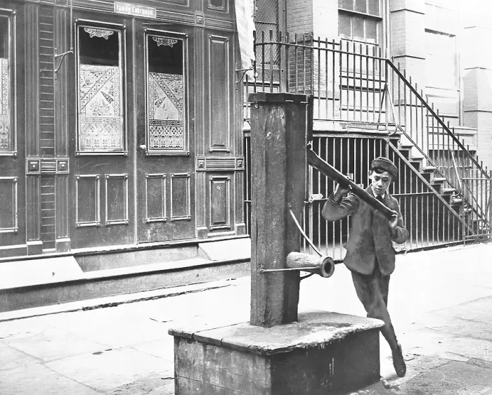 Framed Print : Boy Examining Old Water Pump Framed Print : Boy Examining Old Water Pump