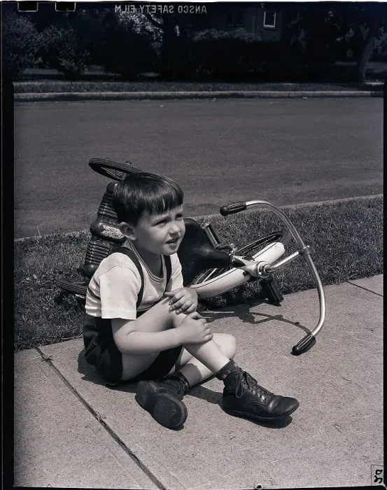 Framed Print : Boy Fallen Off Tricycle and Holding Knee Framed Print : Boy Fallen Off Tricycle and Holding Knee