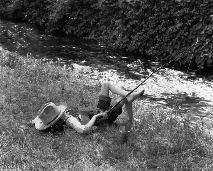 Framed Print : Boy Fishing with Hat Over Face Framed Print : Boy Fishing with Hat Over Face
