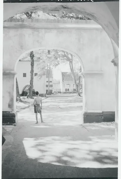 Framed Print : Boy Gazing out from Underneath Archway Framed Print : Boy Gazing out from Underneath Archway