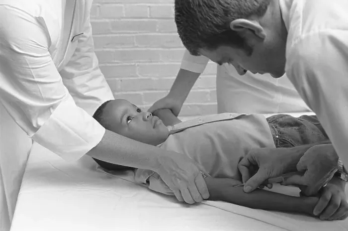 Framed Print : Boy Getting Blood Taken Framed Print : Boy Getting Blood Taken