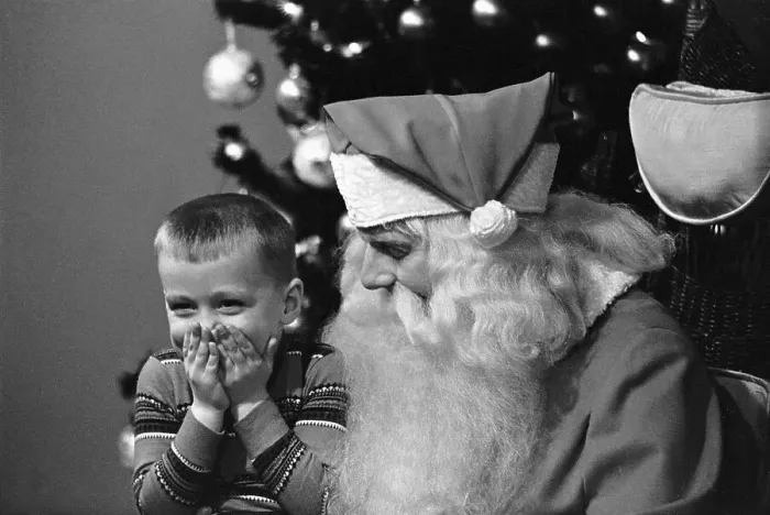Framed Print : Boy Giggles While Seated on Santa's Lap