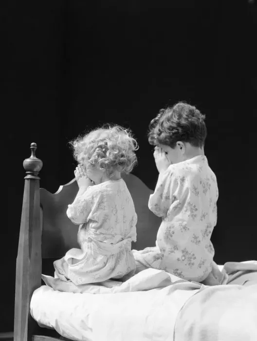 Framed Print : Boy and girl kneeling by bed praying, rear view Framed Print : Boy and girl kneeling by bed praying, rear view