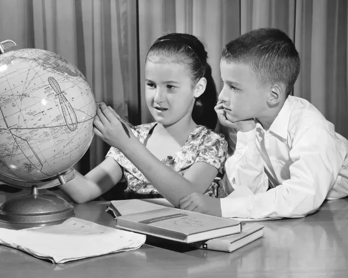 Framed Print : Boy and girl looking at globe Framed Print : Boy and girl looking at globe