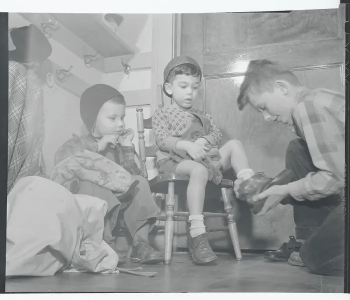 Framed Print : Boy Helping Dress Nursery Schoolers