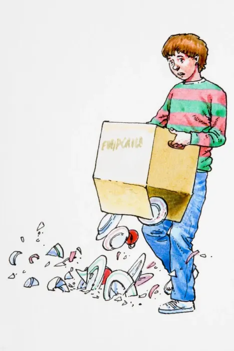 Framed Print : Boy holding box, contents dropping onto floor Framed Print : Boy holding box, contents dropping onto floor