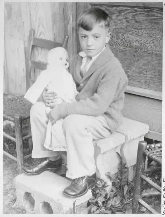Framed Print : Boy Holding a Doll